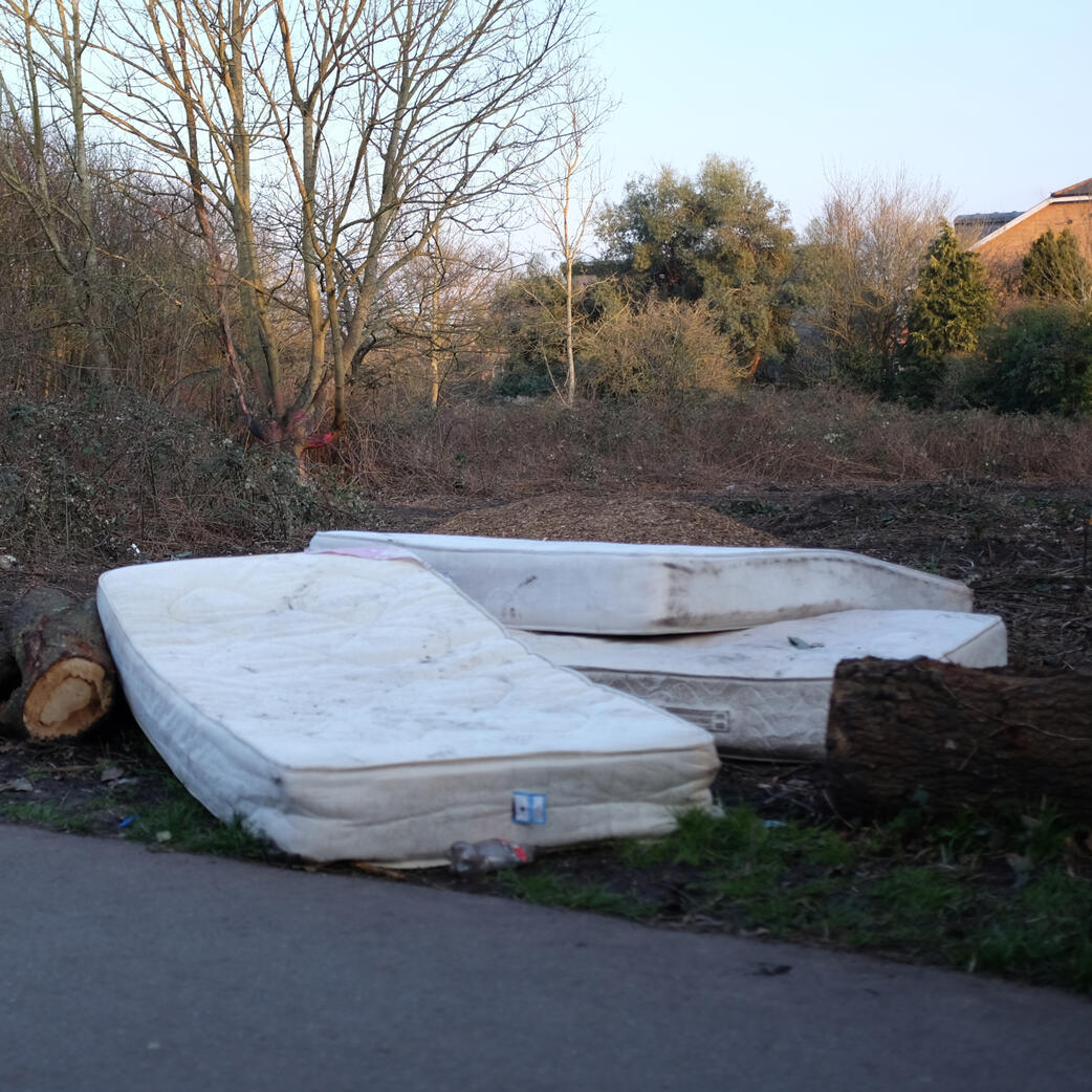 Three discarded mattress near the path in mereway nature reserve Three discarded mattress near the path in mereway nature reserve